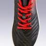 KIPSTA - حذاء كرة قدم برقبة للأرضيات الصلبة أجيليتي 100 ف.ج - أسود/أحمر، مقاس 30 أوروبي