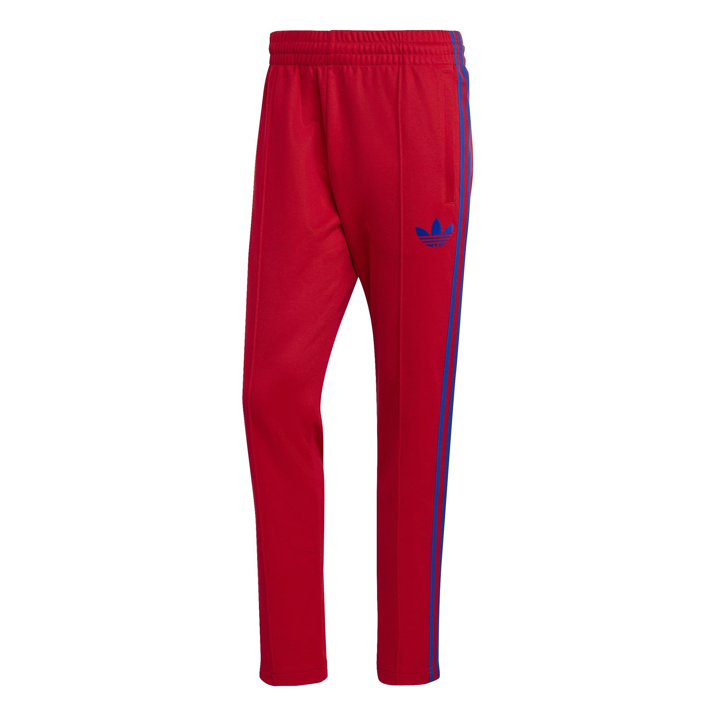 Adidas track pants blue with sales red stripes